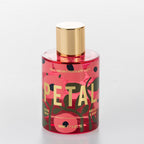 The Aromatherapy Co. Petal Hibiscus & Berry room spray in a pink floral bottle with gold cap.