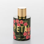 The Aromatherapy Co. Petal Jasmine & Pear room spray in a green floral bottle with gold cap.