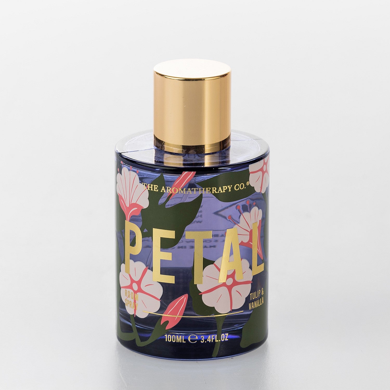 The Aromatherapy Co. Petal Tulip & Vanilla room spray in a blue floral bottle with gold cap.