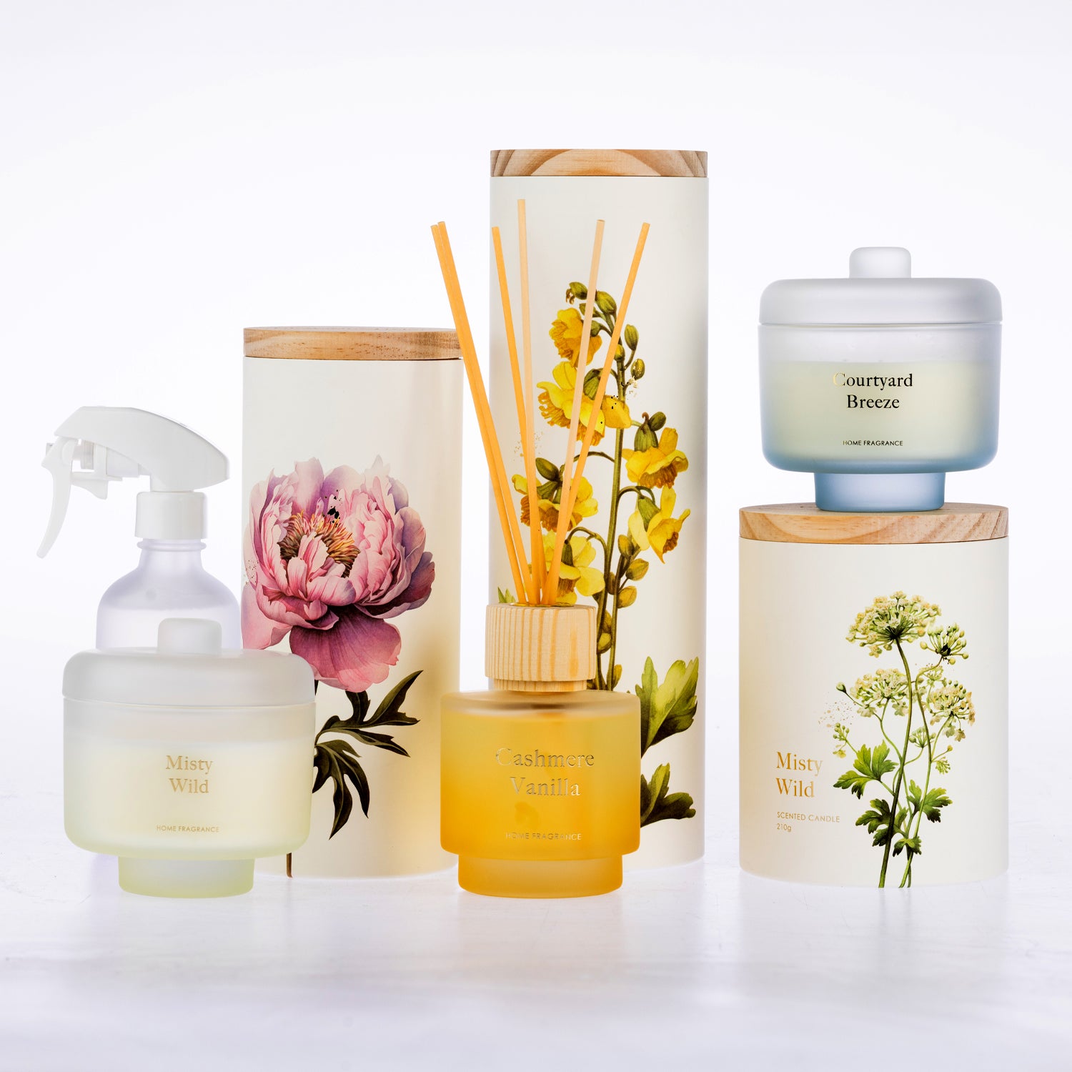 A coordinated set of fragrance products arranged on a white studio background.