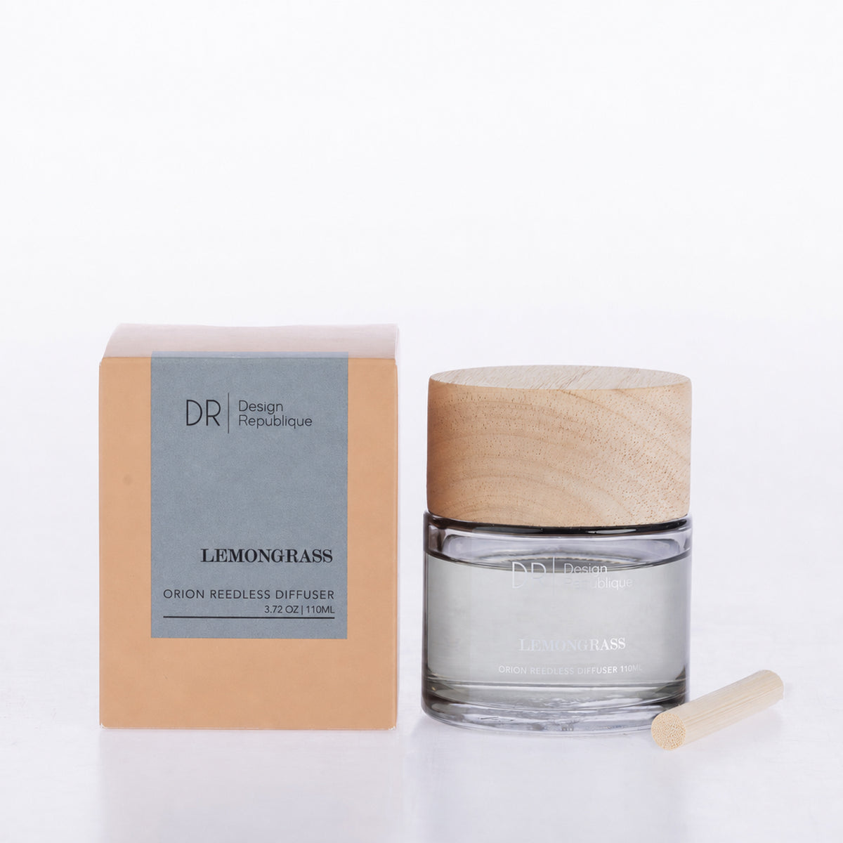 Design Republique Orion Reedless Diffuser in Lemongrass, featuring a clear glass vessel, natural wood-look lid and bamboo diffuser insert, shown with coordinating packaging.