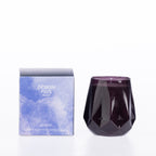Design Plus Home Berry Ebony Scented Candle 230g in a dark purple faceted glass vessel, displayed beside its purple packaging.
