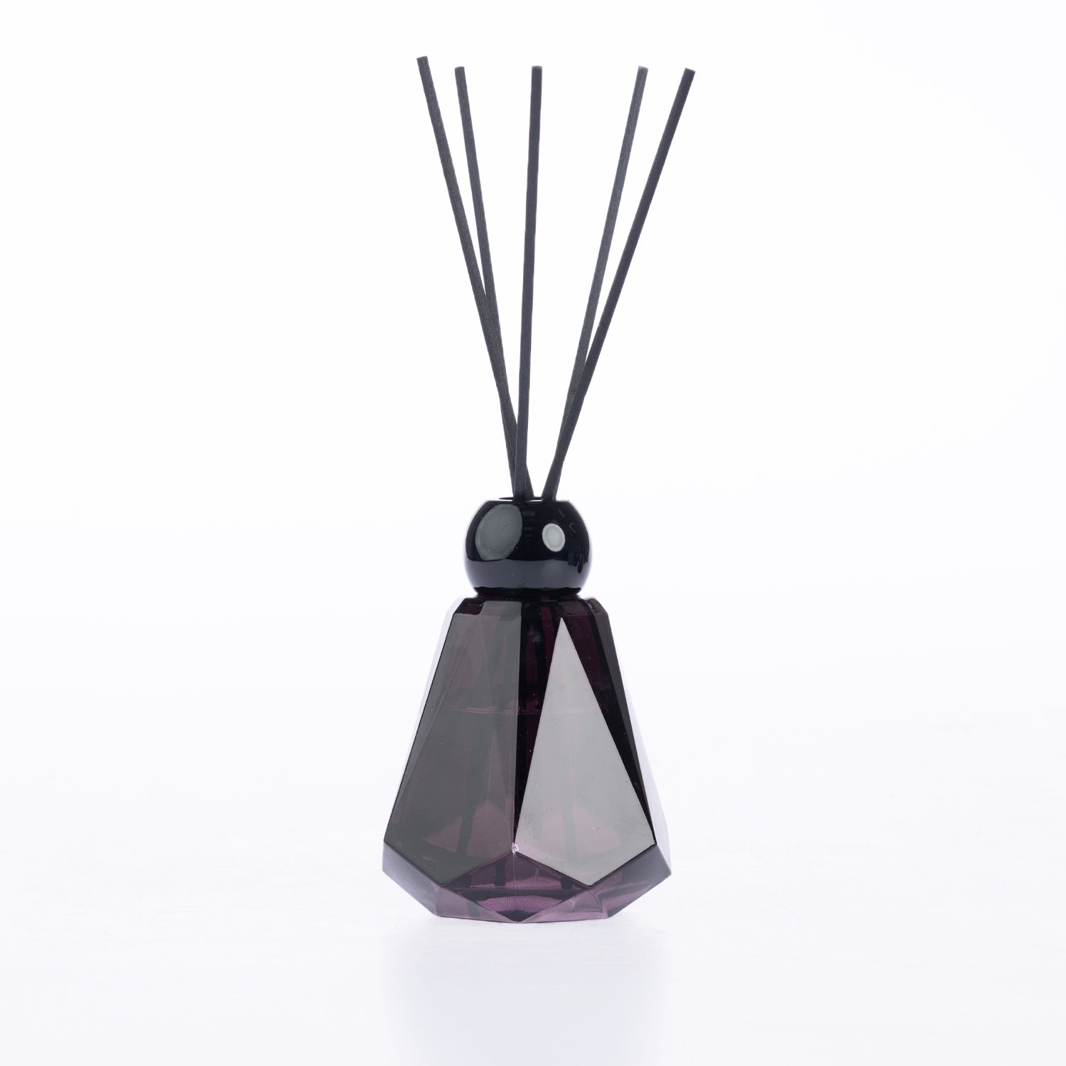 Design Plus Home Berry Ebony Diffuser 180ml in a dark purple faceted glass vessel with black reed sticks and a glossy black cap.