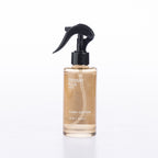 Design Plus Linen Spray 180ml in Ivory Cotton, featuring a clear spray bottle with black pump and minimalist label design.
