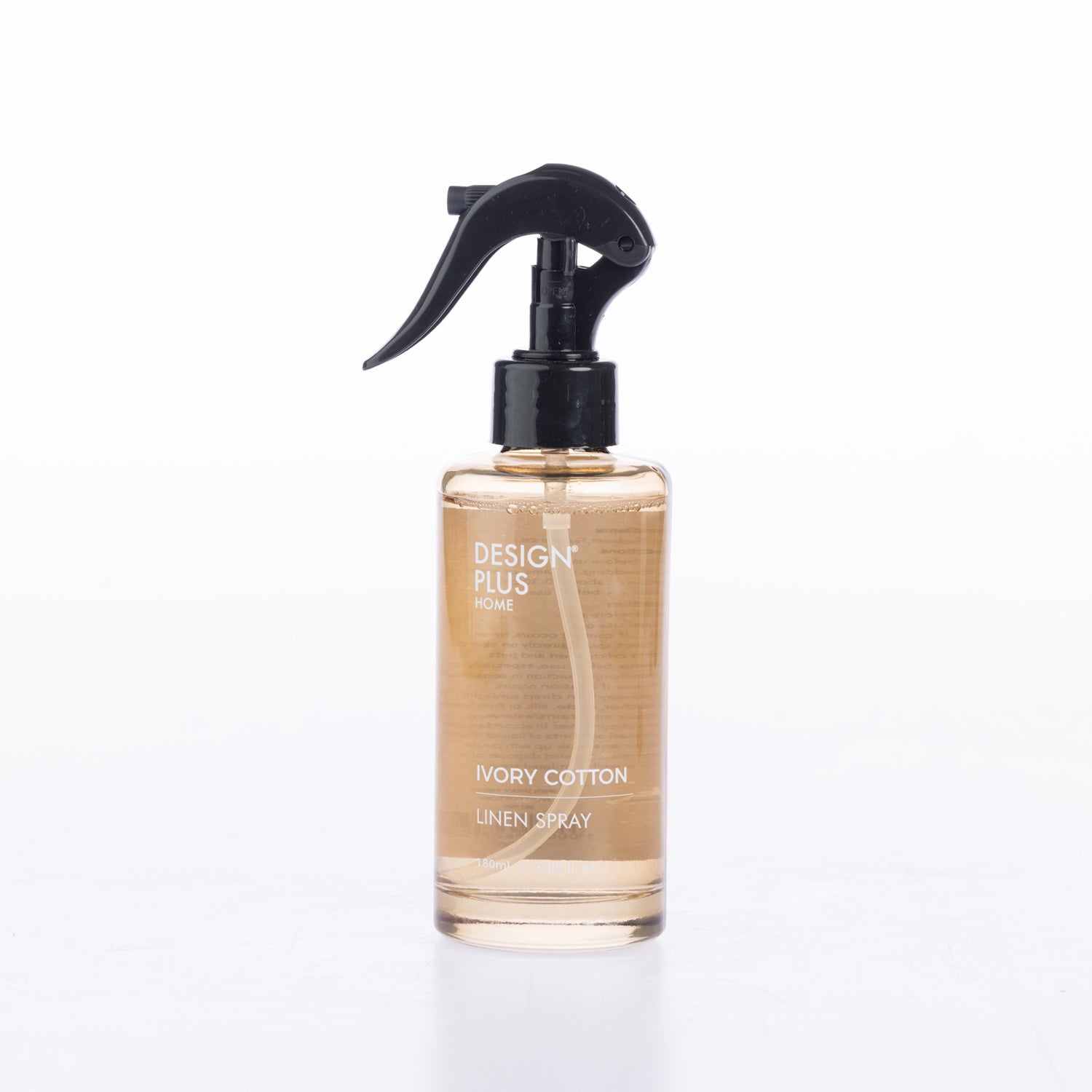 Design Plus Linen Spray 180ml in Ivory Cotton, featuring a clear spray bottle with black pump and minimalist label design.