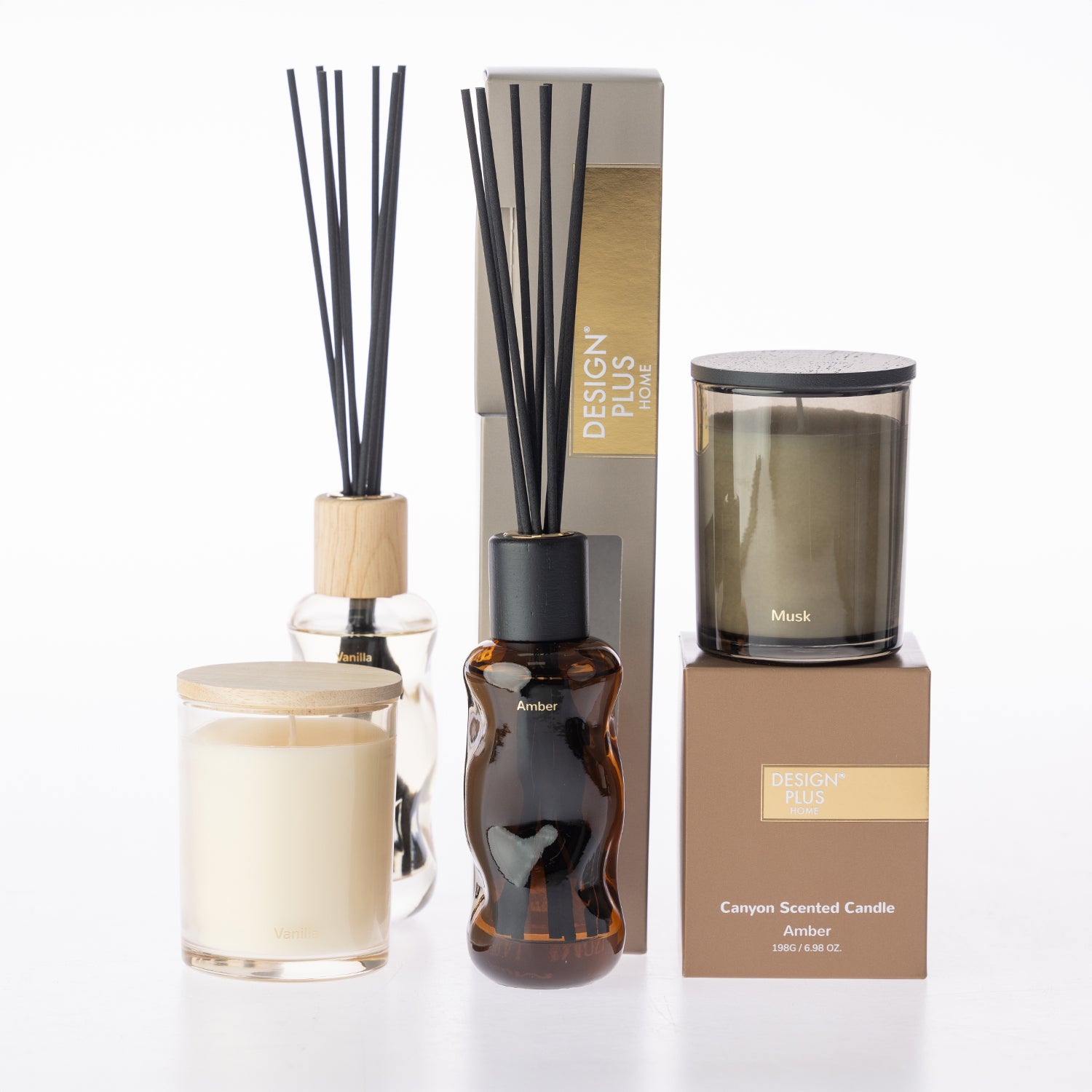 A variety of home fragrance reed diffusers and glass jar candles.