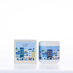 Design Republique Ines Lychee Berry 200g scented candle with blue illustrated buildings on a white vessel and matching packaging.