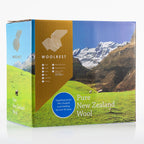 Woolrest 600gsm NZ Wool Duvet Inner in its packaging box with land and sheep on the box displayed on a white background 