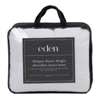 Eden 800gsm Winter Weight Microfibre Duvet Inner in packaging in a clear bag with black handles and sides displayed on a white background.