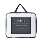 Eden 500gsm Wool Blend Duvet Inner packaging in a clear bag with black handles and sides 