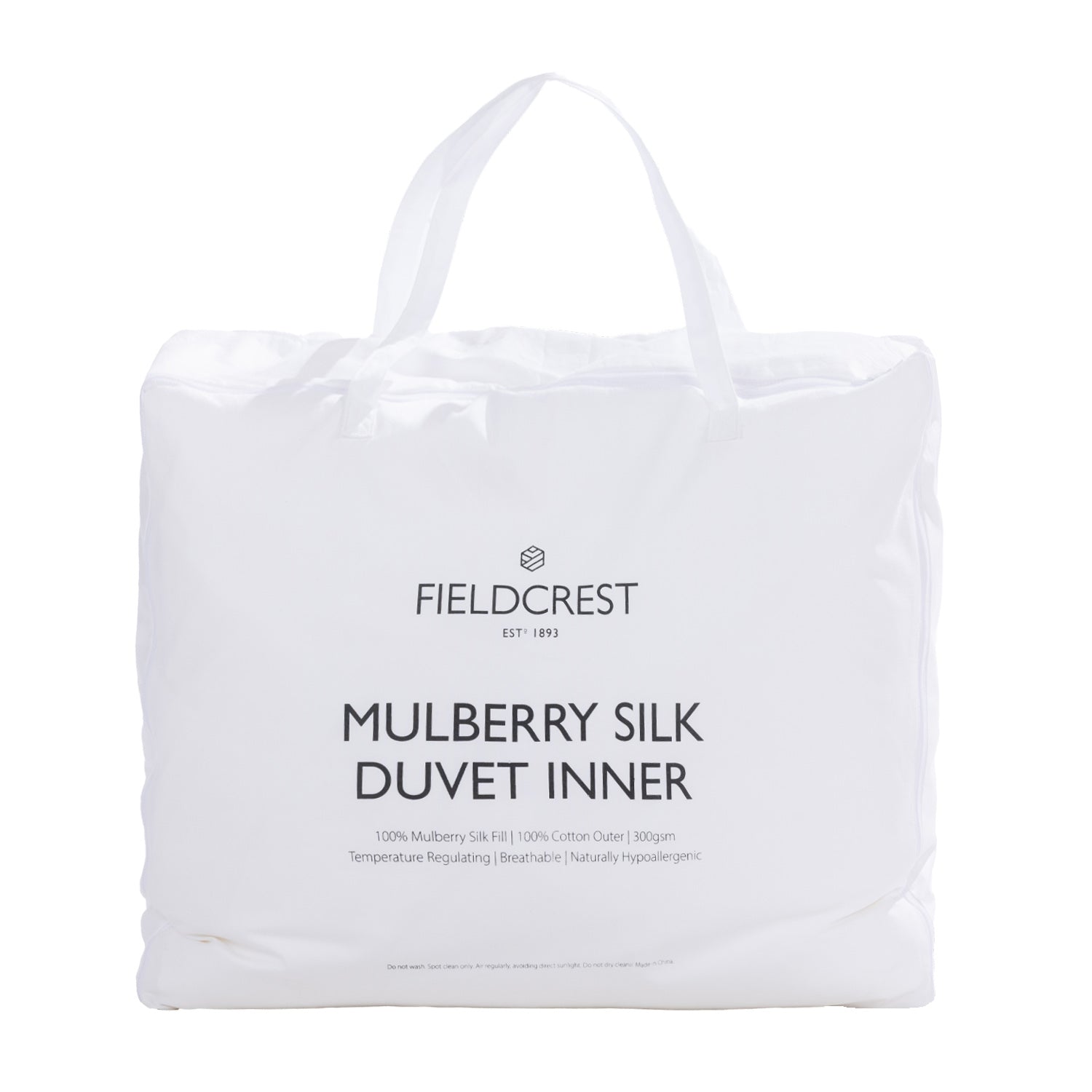 Fieldcrest Mulberry Silk Duvet Inner packaged in a white carry bag with handles, featuring Fieldcrest branding and product details on the front.