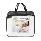 Woolrest Silver Collection 250 + 350gsm 100% Wool Combo Duvet Inner in white, presented in a black carry bag with clear front panel and product insert.