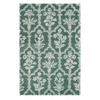 Design Republique Asher Wool Rug in Forest featuring an intricate white floral and geometric pattern on a deep green background.