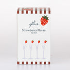 Front view of the Gather Strawberry Flutes 4 Piece Set retail packaging featuring a strawberry design and product illustration.