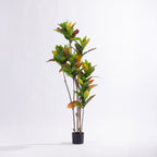 Artificial 145cm codiaeum tree with vibrant green, yellow, orange and red variegated foliage displayed in a black nursery pot.