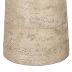 Close-up of the natural cement pedestal base showcasing the textured travertine-look finish with subtle tonal variation.