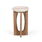 Rear view of a natural stone top side table with sculptural solid wood base.
