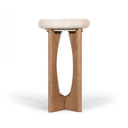 Side profile of a natural stone top side table with an architectural solid wood pedestal base.