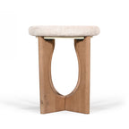 Side view of the Amparo Fleur stone side table with a thick stone top and natural wood base.