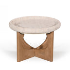 Amparo Fleur stone coffee table with a rounded stone top and sculpted natural wood base on a white background.