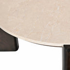 Close-up of the cream marble tabletop showcasing the natural veining and smooth polished finish.
Side profile of the round coffee table highlighting the slim marble top and four solid dark brown timber legs.