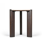 Side profile of the round side table featuring a slim cream marble top and three visible solid dark brown timber legs on a white background.