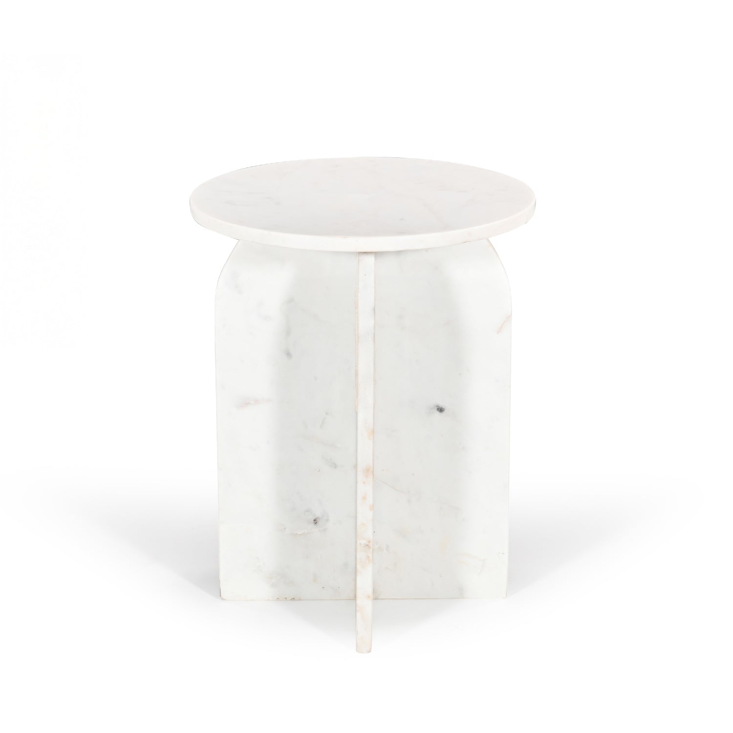 Front view of the white marble side table on a white background, highlighting the sculptural intersecting pedestal base and round marble top.