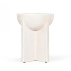 Amparo mango wood side table in white wood shown from the back against a plain white background, showing the smooth curved top and panelled base.