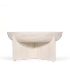 Amparo mango wood coffee table in white wood shown from the back against a plain white background, highlighting the curved base panels and rounded tabletop.