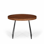 Large Amparo Acacia coffee table with round wooden tray-style top and black iron legs.