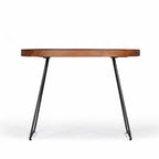 Large Amparo Acacia coffee table shown from the front with round wooden tray-style top.