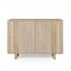 Front view of the Vicky sideboard in natural mango wood featuring slatted cupboard doors, rounded corners, and a clean contemporary design.