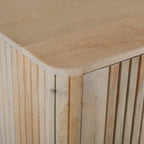 Close-up of the Vicky sideboard highlighting the rounded corner profile, slatted mango wood detailing, and natural wood grain.