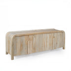 Shona entertainment unit in natural mango wood with four-door storage, rounded corners, sculpted timber handles, and a modern curved silhouette.