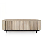 Natural mango wood entertainment unit with fluted sliding doors, rounded ends, and black metal legs on a white background.