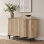 Amparo Mango Iron Sideboard styled in a neutral living space with a vase, books and decorative bowl on top.