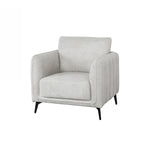 A light gray upholstered accent chair with a high back, wide armrests, vertical channel tufting on the sides, and slim black metal legs, shown on a plain white background.
