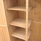 Wooden storage shed with open doors.