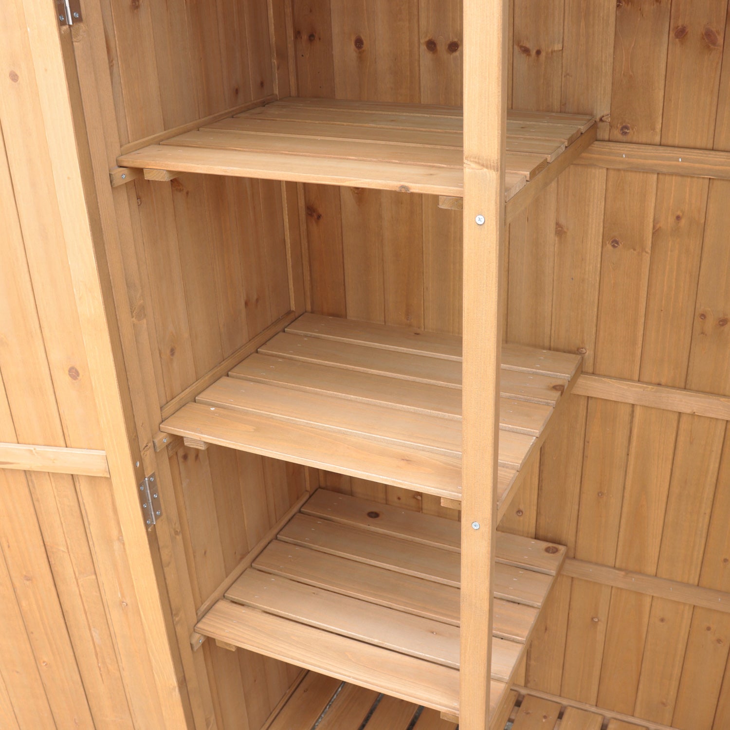 Wooden storage shed with open doors.