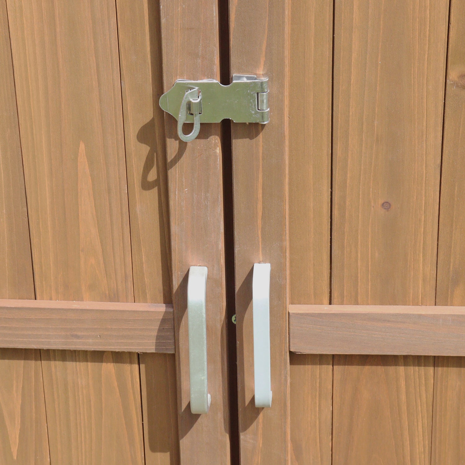 Wooden door with metal handle and lock.