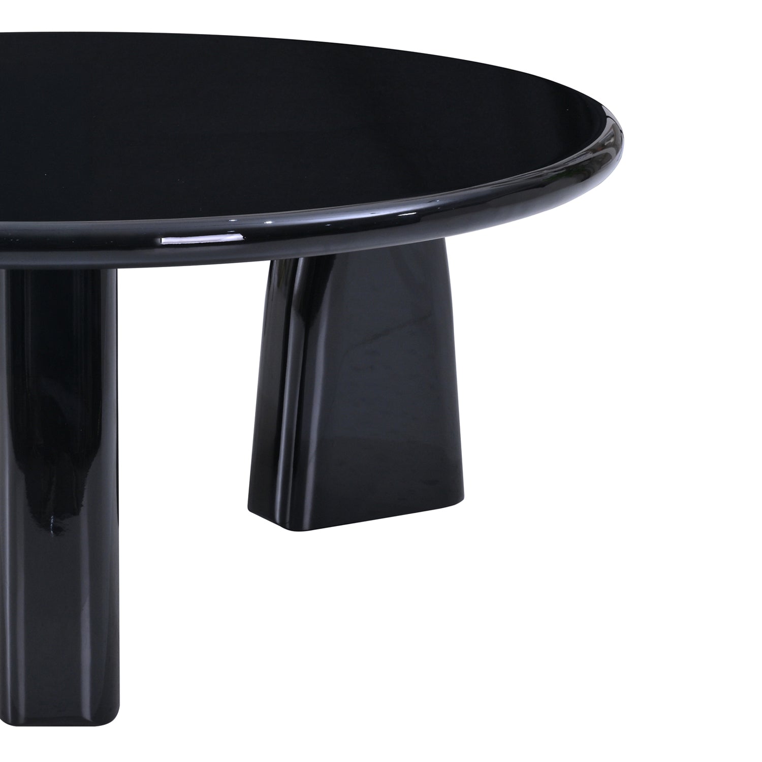 Close-up of the Design Republique black lacquer coffee table showing the glossy round edge and leg detail.