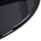 Close-up of the Design Republique black lacquer coffee table showing the glossy black tabletop finish and rounded edge.