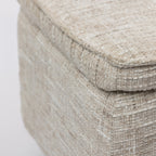 Close-up of the Design Republique oatmeal upholstered storage bench showcasing the textured woven fabric and cushioned lid.