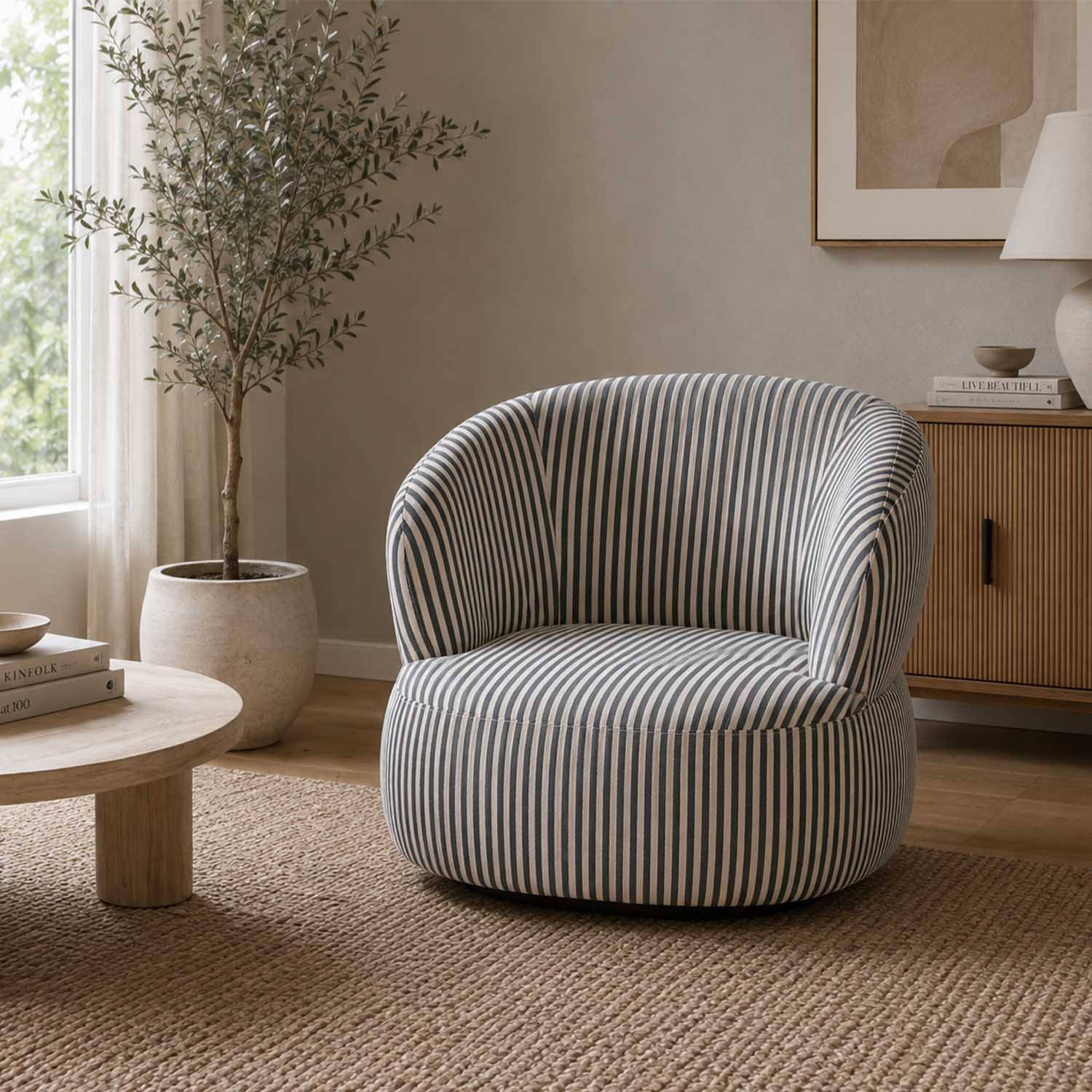 Design Republique Eve Swivel Chair in green and cream stripe upholstery styled in a neutral living room.