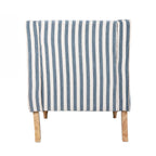 A blue and white striped upholstered accent armchair with turned wooden legs offers classic coastal style and inviting comfort.