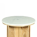 Close-up of the Design Republique Sara side table showing the round white marble tabletop and natural wood base.