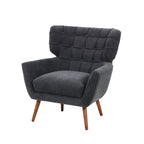 Charcoal upholstered accent armchair featuring a button-tufted wingback backrest, generously padded seat cushion and tapered wooden legs.