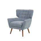 Grey-blue upholstered armchair with a button-tufted wingback design, wide cushioned seat, angled armrests and tapered wooden legs.