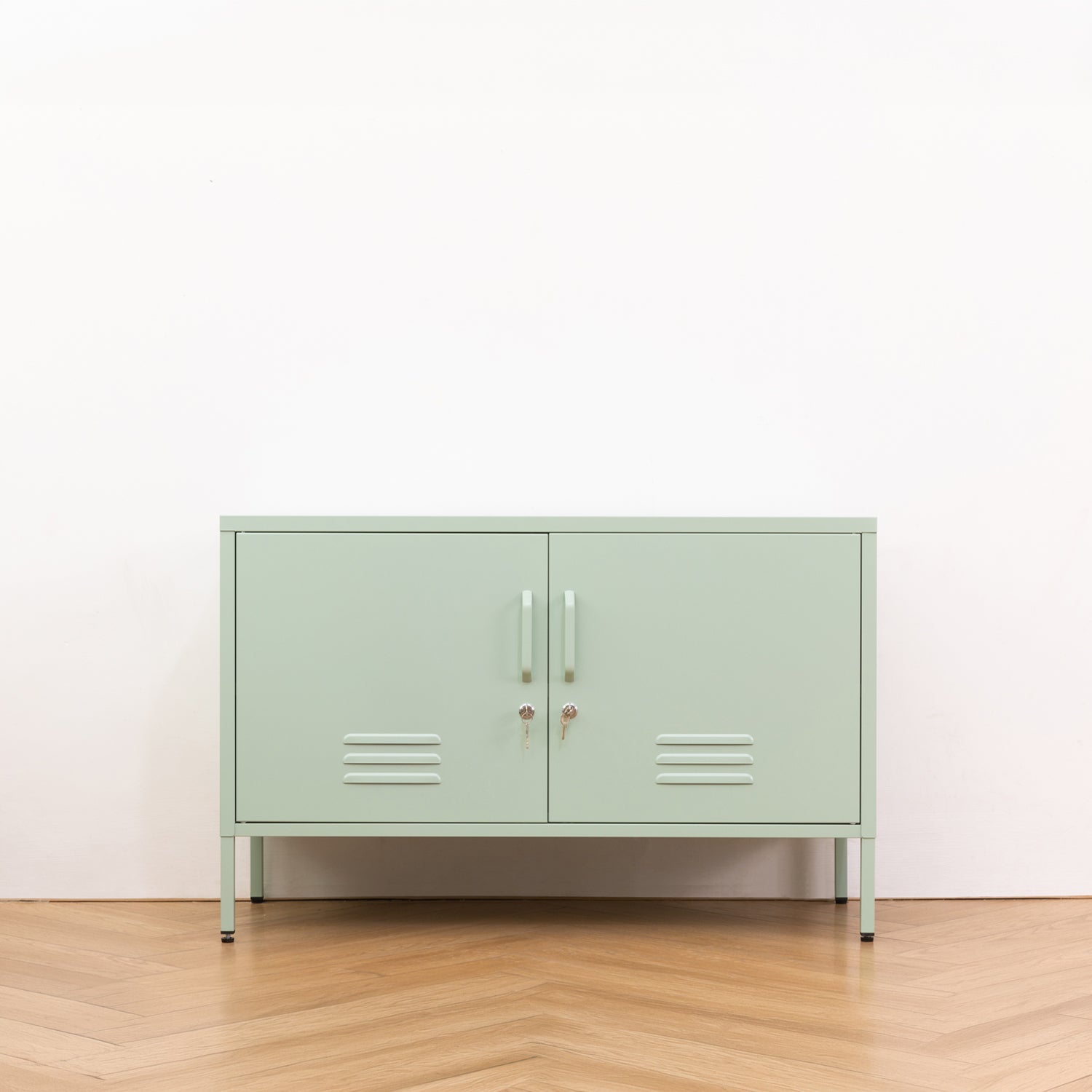 Design Republique Mila Low Locker Sage shown closed in a room setting with double doors, handles, locks and vent details.