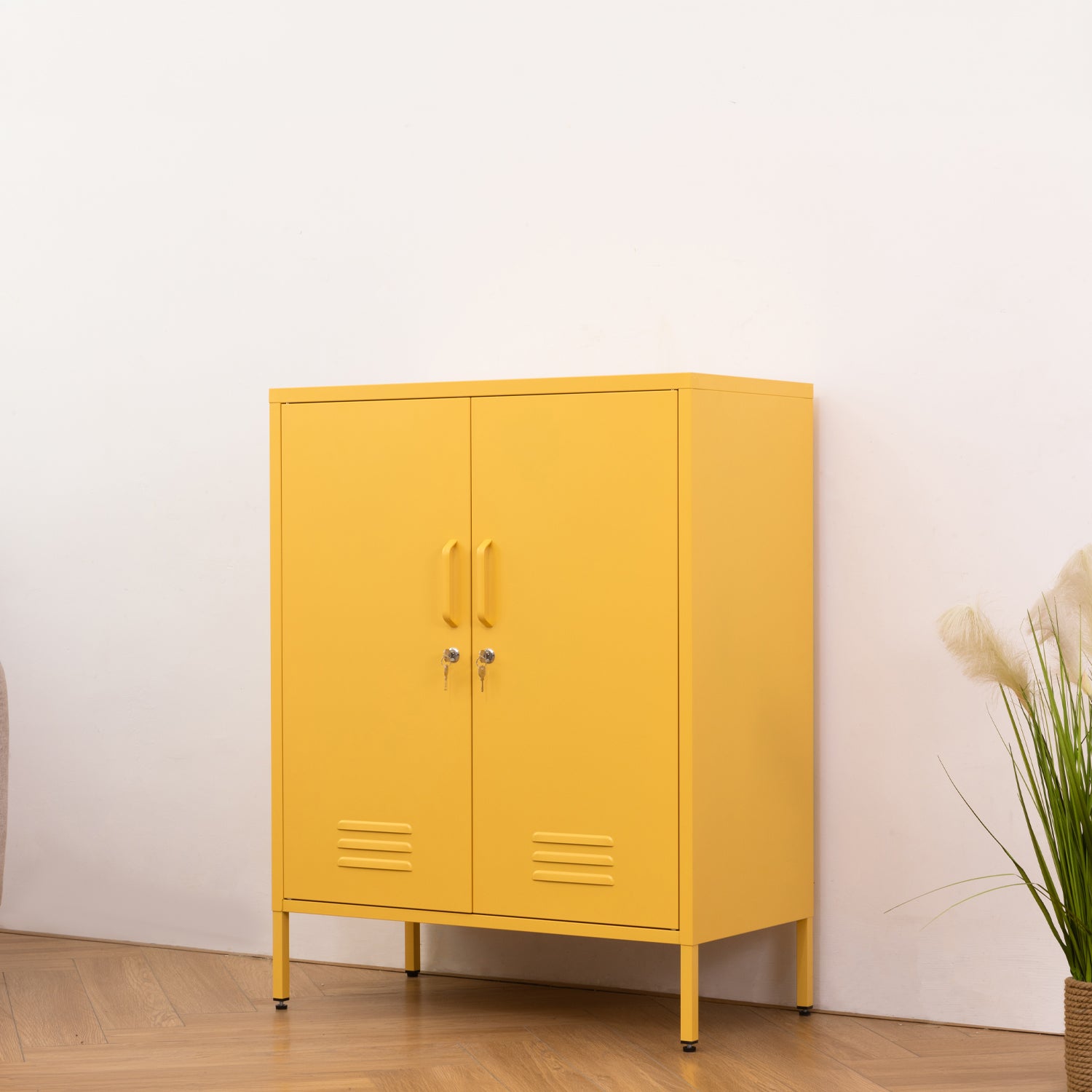 Design Republique Mila Sideboard Butter shown closed on an angle with a bright butter yellow metal finish.